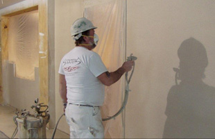 Man painting the wall